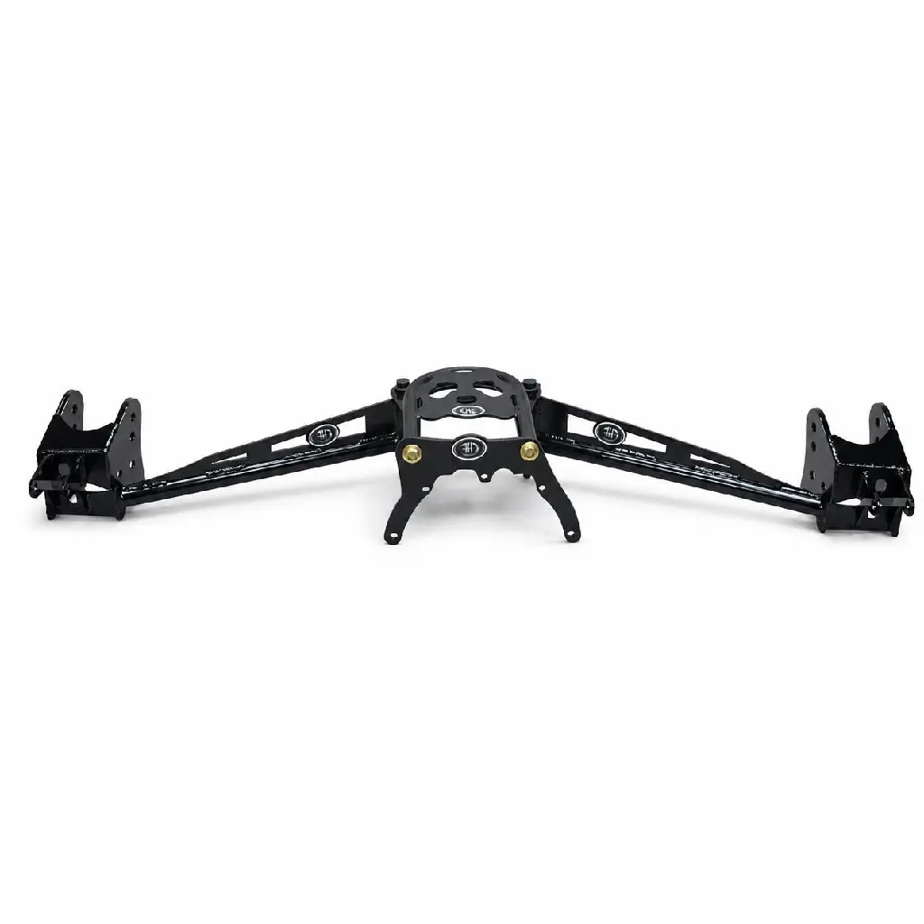Keep the complete long black suspension assembly exactly as shown from end to end, including both end brackets, the diagonal support bars, the central mounting plate and housing, lower curved arms, logos, labels, lettering, holes, bolts, gold-colored.webp
